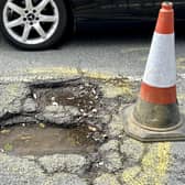 The potholes in Grand Avenue, Worthing have 'reached a critical level' - so residents have taken matters into their own hands by putting down cones