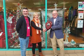 Hailsham charity shop wins best dressed Christmas window competition (photo from HTC) - L-R: Graham Wellock, Heather Reece, Mark Hallett