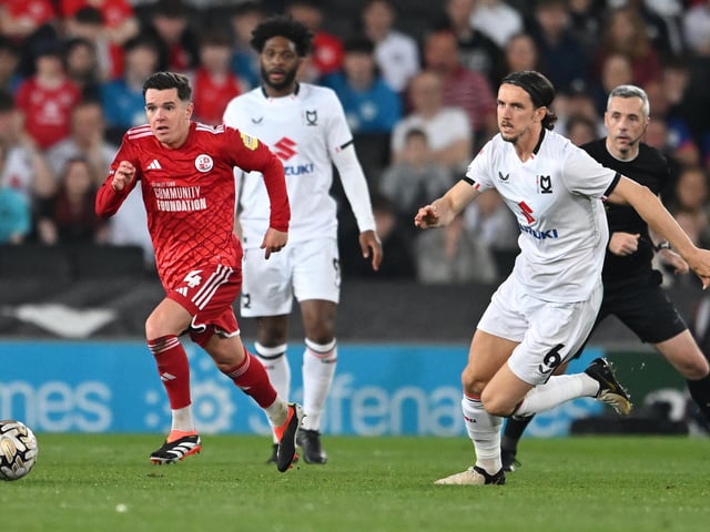 Crawley Town midfielder Liam Kelly (4) sprints forward with the ball under pressure fromMilton Keynes Dons midfielder M J Williams (6) during the EFL Sky Bet League 2 play-off second leg match between Milton Keynes Dons and Crawley Town at stadium:mk, Milton Keynes, England on 11 May 2024.:Crawley Town hammered MK Dons 5-1 - and 8-1 on aggregate - to reach the League Two play-off final Wembley. Photographer Dennis Goodwin/Pro Sport Images was there to catch the action, the crowd and the celebrations