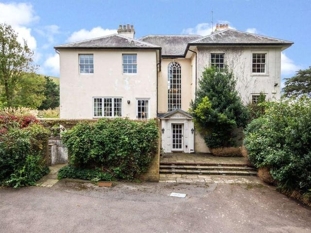 The northern elevation of the house - to the far south-eastern corner is an enclosed wildflower meadow planted with fruit trees, and at the far end of the lawn a 'Little House' - a former stable in the style of the main house, with power connected