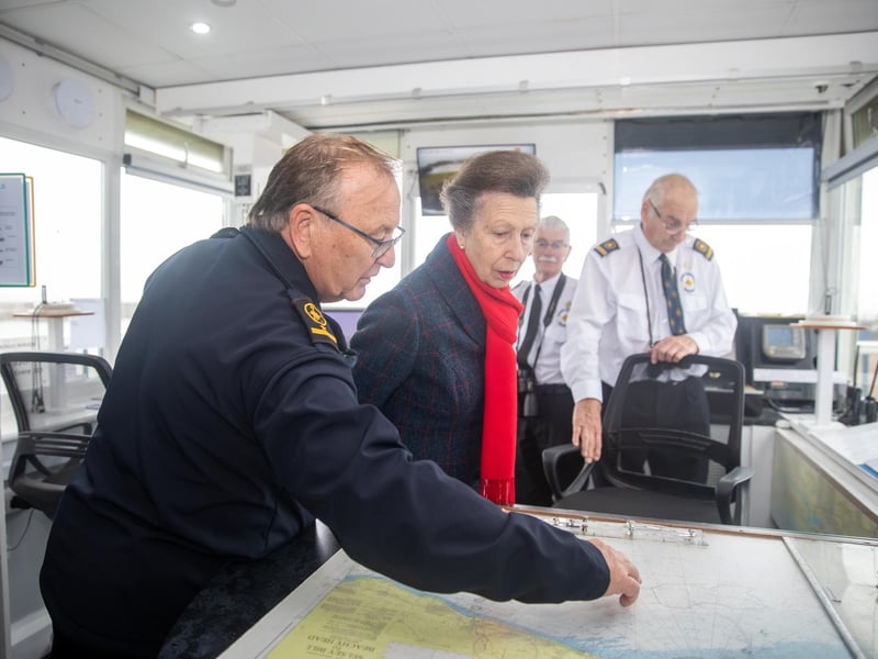 Colin Clay, Shoreham station manager, shows The Princess Royal the maps the watchkeepers use
