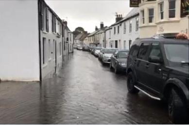 Looking south down Tarring High Street during flooding in August 2018