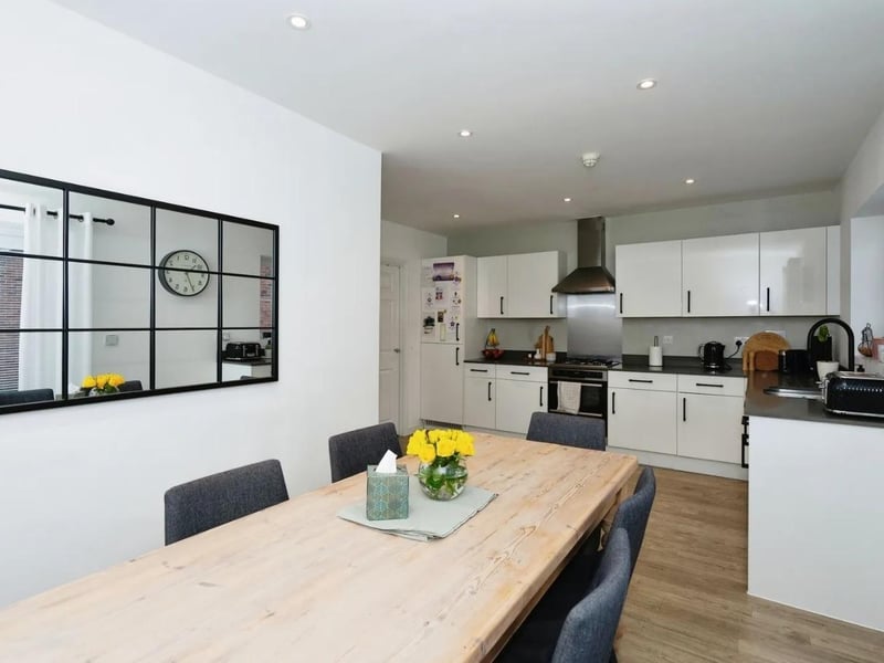 The kitchen/dining room has an adjoining utility room