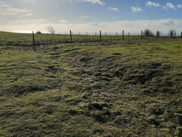 At the top, you will see a fence and if you walk right up to it, you are treated to a distant view of the sea at Worthing.