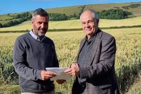 Iford Estate Manager Ben Taylor and the National Park Authority’s Chief Executive Trevor Beattie sign the agreement that will bring a boost for wildlife in the region. Photo: South Downs National Park Authority