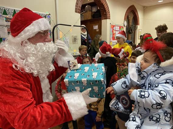 Cllr Ray Cade stepped in as Santa for Ukrainian refugees in Wealden