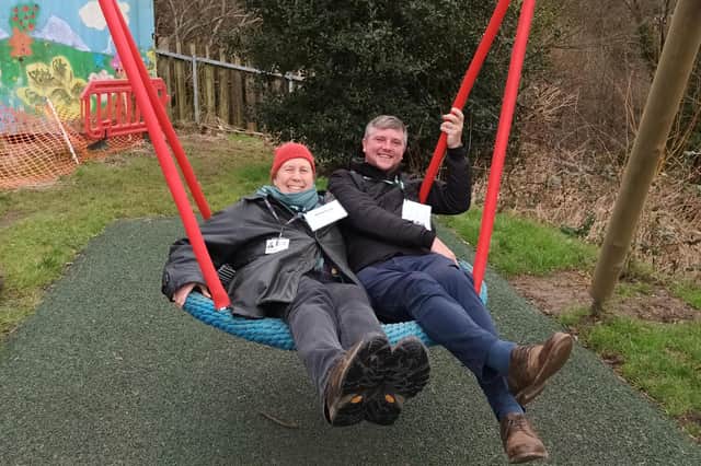 Council leader Julia Hilton tries out the new basket swing
