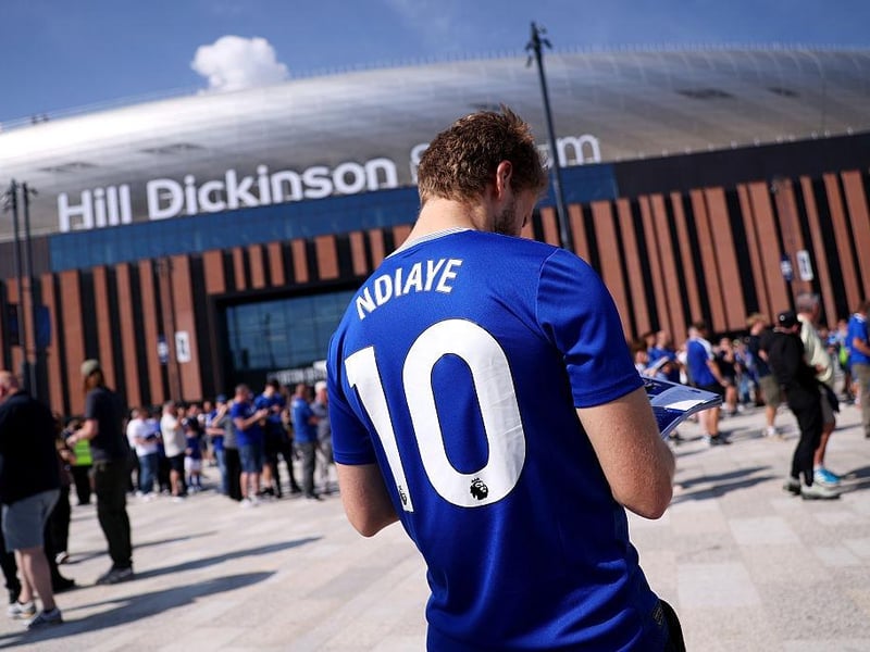 A fan of Everton is seen outside the stadium wearing replica shirt with the name of Iliman Ndiaye
