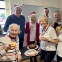 Members of the Friends of Bishopstone Station celebrate one year of hosting Meet-up-Monday events