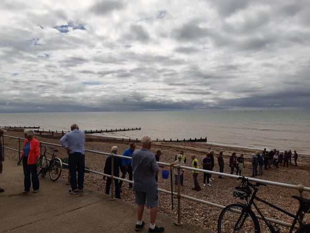 A bucket chain of volunteers from Ferring History Group and Ferring Conservation Group, including Worthing West MP Sir Peter Bottomley, form a bucket chain to bail out nine inches of water from the Ferring pillbox