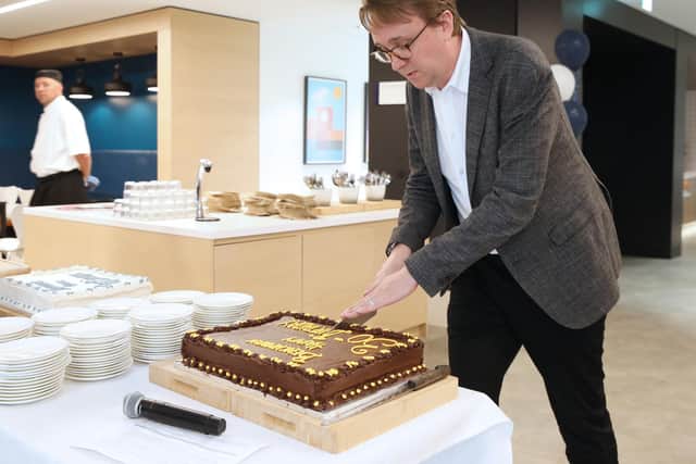 Benchmark managing director Ed Dymott led a special celebratory cake cutting and toast to Horsham business Benchmark's 30th anniversary. Photo contributed