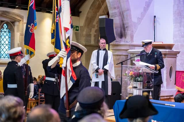 Standard bearers during the Act of Remembrance, with the Rev Sam Buck, centre, and Lieutenant Commander Noel Atkins at the lectern. Picture: Andrew Mardell