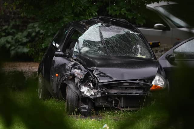 Pictures from the one-vehicle crash on the A24 northbound. Pictures by Eddie Mitchell