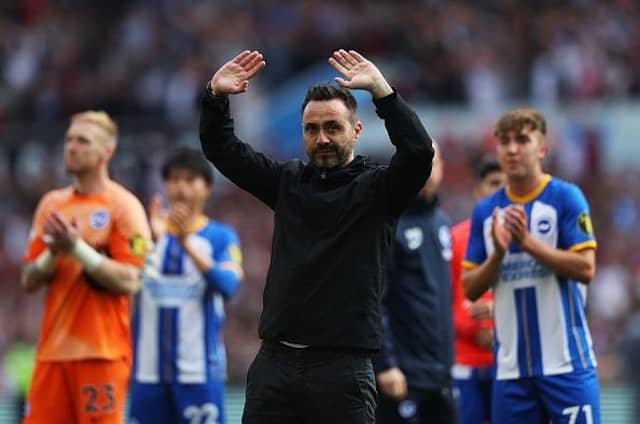 Roberto De Zerbi, manager of Brighton & Hove Albion, acknowledges the fans after the final whistle of the Premier League match at Aston Villa
