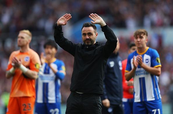 Roberto De Zerbi, manager of Brighton & Hove Albion, acknowledges the fans after the final whistle of the Premier League match at Aston Villa