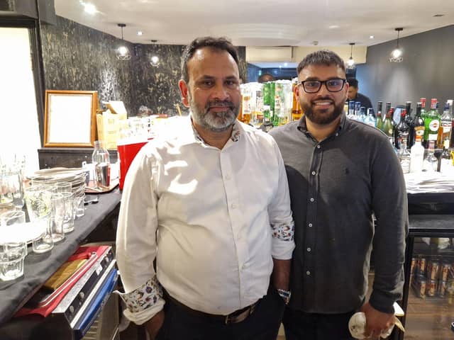 Darchini owner Syed Hossain with his son Fahim. Photo: Sussex World