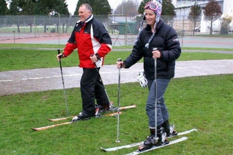 Peter and Bernadette Manning skiing around Chichester College’s rugby pitch