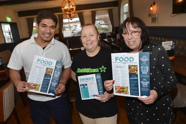 The Wheatsheaf Inn in Little Common changed management on February 5 2024: L-R: New chef K Roberts, Cheryl West, pub manager, and barmaid Nunzia Walter.