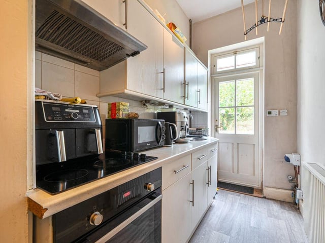 The self-contained one-bedroom annexe may be approached from the side of the main house