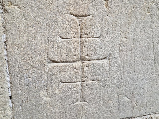 Crusader graffiti carved into the stone includes the Cross of Lorraine