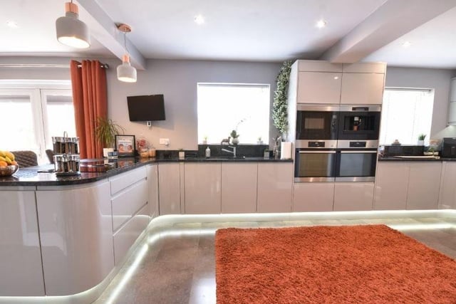 The kitchen boasts granite worktops, double oven, built in microwave and coffee machine