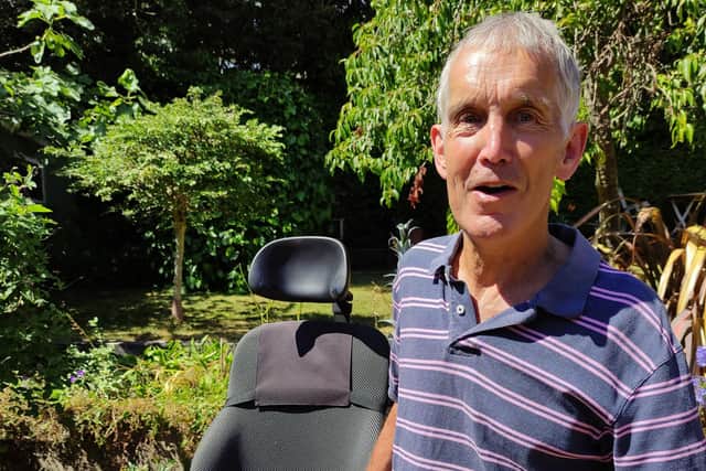Andy Davies, pictured with his powerchair in his garden, has created the Thames Source to Sea Challenge for Muscular Dystrophy UK