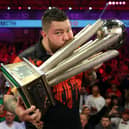 More than 1.5 million people saw Michael Smith lift the prestigious prize at the Alexandra Palace after he defeated Michael van Gerwen 7-4 in the final. (Photo by Luke Walker/Getty Images)