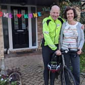 Adam Sims with his wife Christina when he arrived home from his UK coastal cycle challenge. Picture: Adam Sims