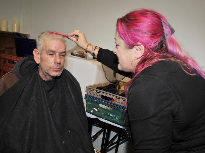 Surviving Christmas 2024 at HIS Place, Robertson Street, Hastings. Photo taken on Boxing Day. Hairdressers at work.
