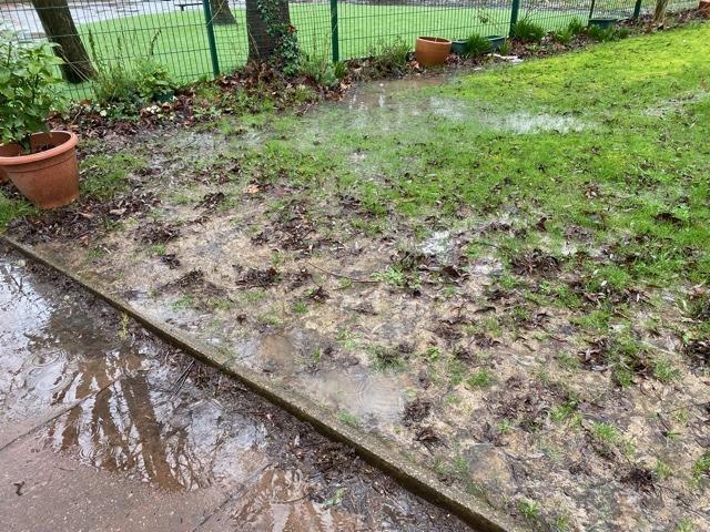 A group of residents are involved in a row with a Worthing primary school after instances of heavy flooding, which they say is destroying their gardens.