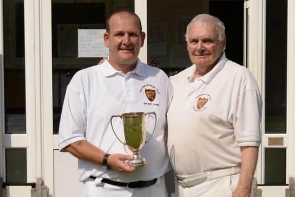 Stewart Angus, holding the Seaford BC Pairs trophy with Ted Pattinson | Contributed picture