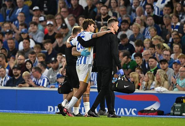Matt O'Riley of Brighton & Hove Albion is helped from the field after getting injured during the Carabao Cup Second Round match against Crawley Town