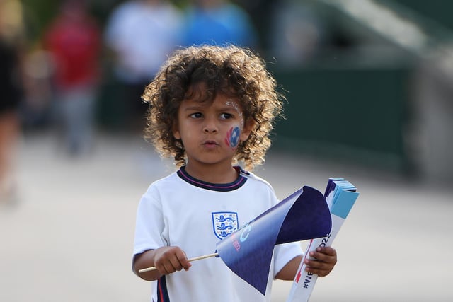A young England fan heads to the stadium.