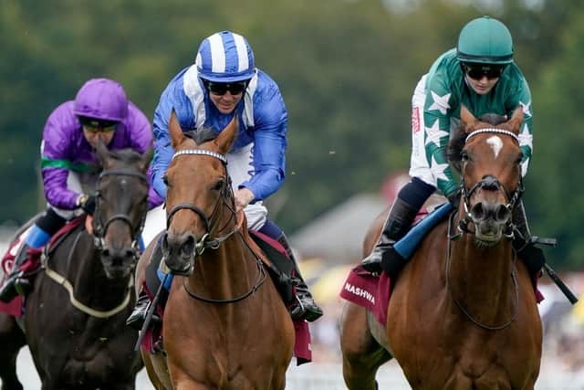 Jim Crowley and Al Husn (blue/white) win The Qatar Nassau Stakes  (Photo by Alan Crowhurst/Getty Images):Action and scenes from Ladies' Day at Glorious Goodwood 2023