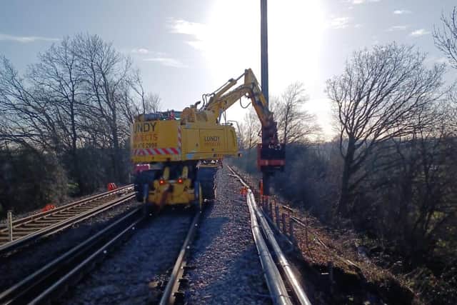 Sheets of steel are being used to form a wall, that ‘underpins the railway and stops it from sliding away’. A flat steel beam was installed on Thursday, which was described as a ‘massive step’ towards getting the railway open again. Photo: Network Rail Kent & Sussex