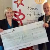 Alan Langley, is pictured presenting the cheque to Madeline Maynard,