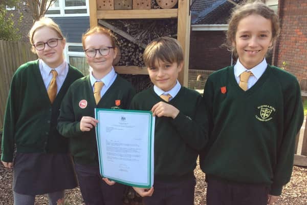 Head Boy, Head Girl and their deputies proudly hold the letter from Damian Hinds