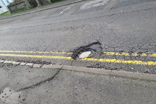 Gill Darbyshire said: "This one is over 6" deep. The stones fly out and hit our cars and its punctured my tyre. Reported twice! It's been there for at least eight months probably more and it's just one of many on that road." (Photo from Gill Darbyshire)