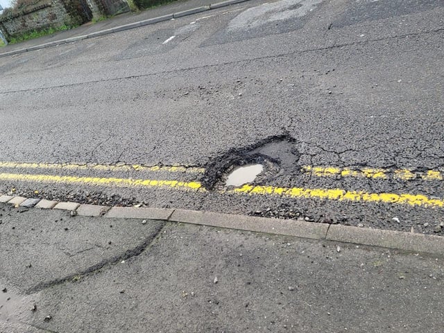 Gill Darbyshire said: "This one is over 6" deep. The stones fly out and hit our cars and its punctured my tyre. Reported twice! It's been there for at least eight months probably more and it's just one of many on that road." (Photo from Gill Darbyshire)