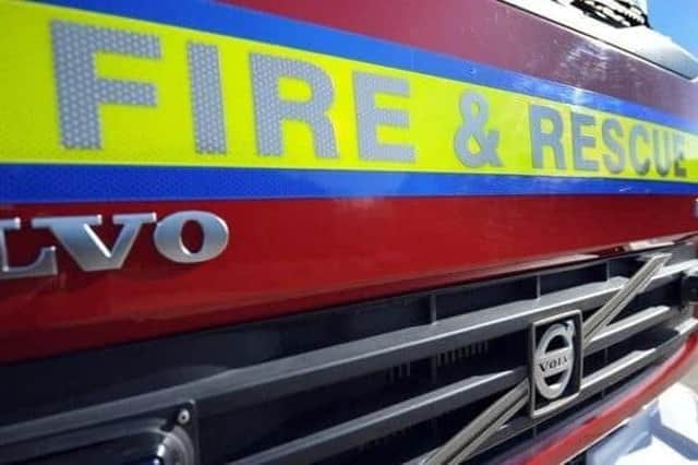 A road in Barcombe has been closed after fire services were called to a car stuck in water.