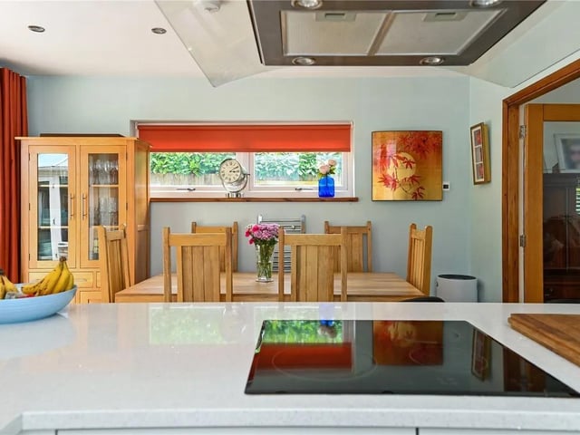 The stylish, well-fitted kitchen comes with everything the modern family needs.