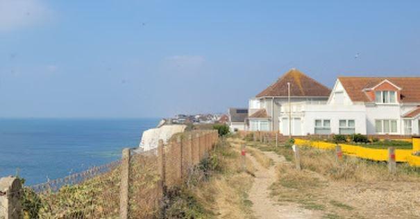 A town in East Sussex offering affordable housing options and a range of amenities, including shops, restaurants, and a community centre