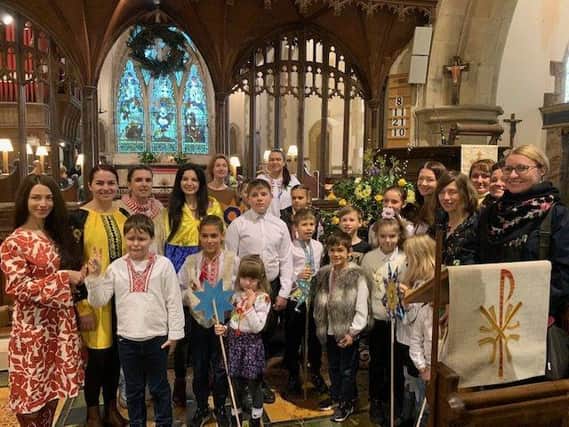 Ukrainian families formed a choir celebrating a Ukrainian Christmas in Fletching Parish Church