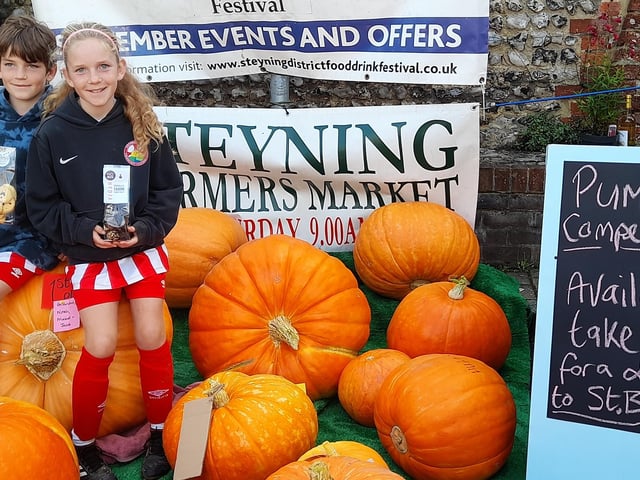 Two of the first prize winners on their champion pumpkin