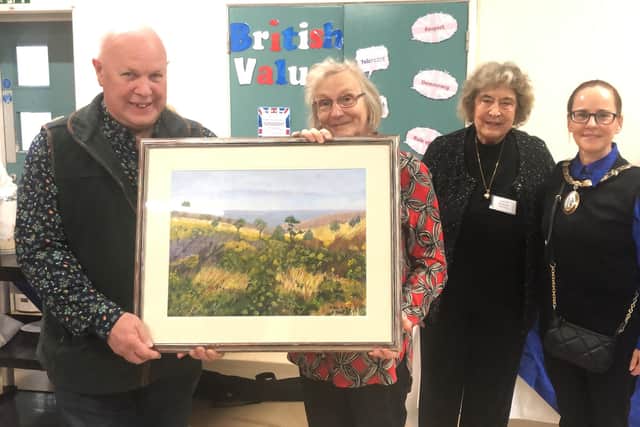 Centre manager Sue Netherway and Ashenground Community Centre charity’s governor Richard Goddard with the oil painting for the centre