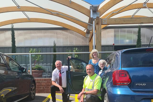 Welcoming Pamela Wilkinson to the new parking bays at Old Barn Nurseries in Dial Post are operations manager, Chris Harland, and branch manager Paul Smythe