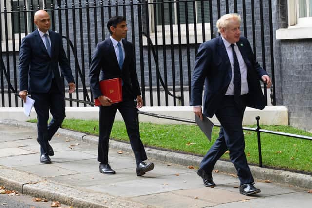 Health Secretary Sajid Javid, Chancellor of the Exchequer Rishi Sunak and Prime Minister Boris Johnson (Photo by Leon Neal/Getty Images)