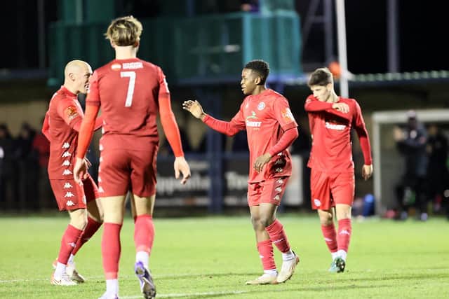 Worthing celebrate Mo Dabre's opener at Chippenham - but he was later sent off and the Reds had to dig in for a point | Picture: Mike Gunn