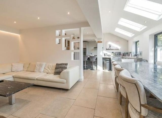 A light and airy family room leading off the top of the range kitchen