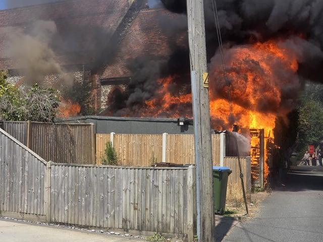 Firefighters tackle a blaze that destroyed two sheds, on Beaconsfield Road